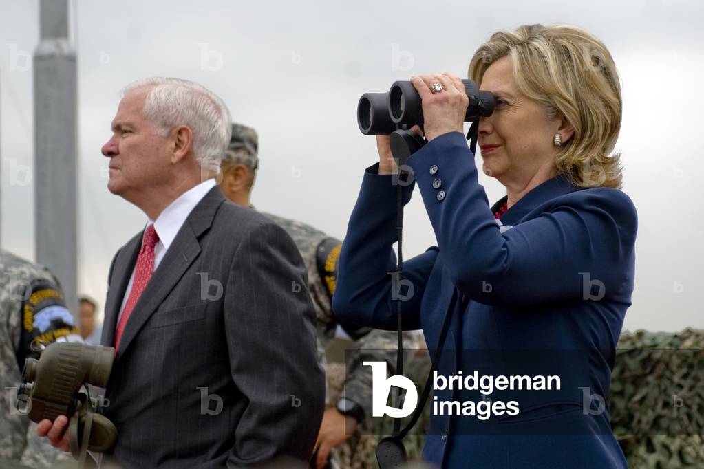 Hillary Clinton and Robert M. Gates look out over North Korea from Observation Point Ouellette during a tour of the Demilitarized Zone in South Korea. July 21 2010