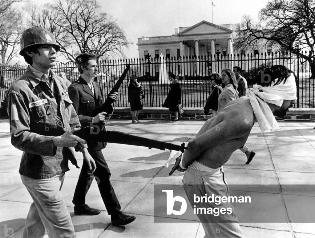 Anti-Vietnam War Protestors calling themselves 'Spring Mobilization for Peace', demonstrating with toy rifles in front of the White House, Washington D.C., 04-08-67