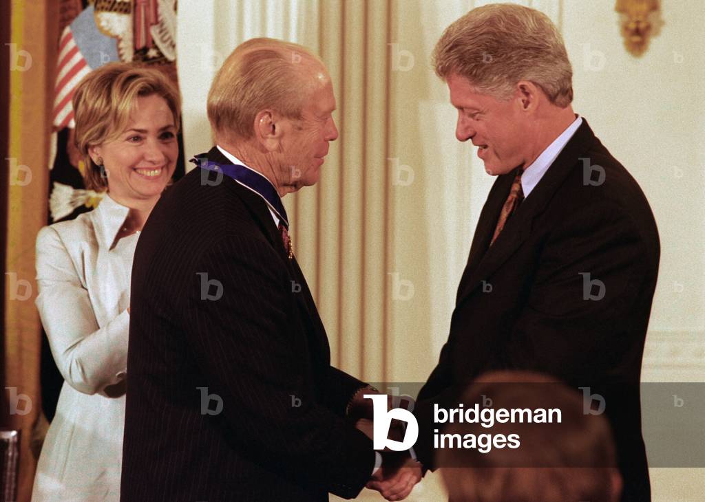 President Clinton awards former President Ford the nation s highest civilian honor the Presidential Medal of Freedom for binding the nation together after 'the nightmare' of Watergate. Aug. 2009