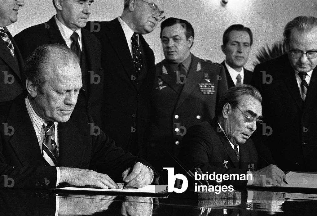 President Ford and Soviet General Secretary Leonid Brezhnev sign a joint communiqu on the limitation of strategic offensive arms. Nov. 24 1974