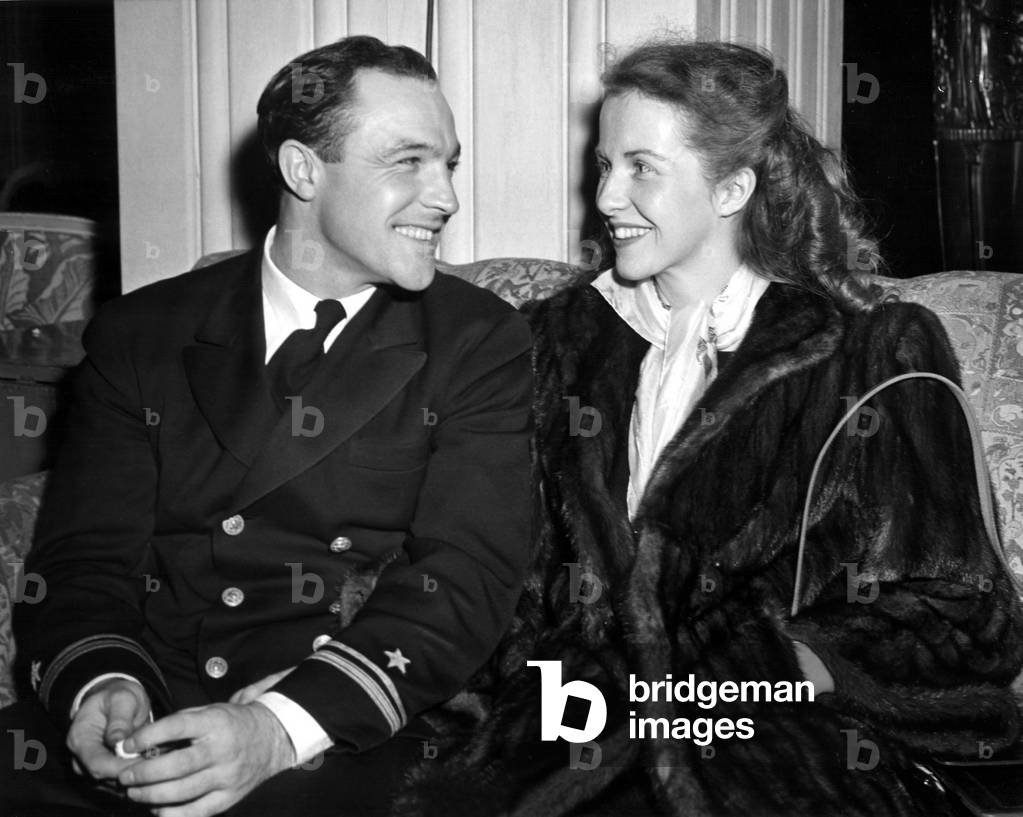 LT. (J.G.) GENE KELLY, on leave from making naval training films, steps out with his wife BETSY BLAIR, 10/14/45