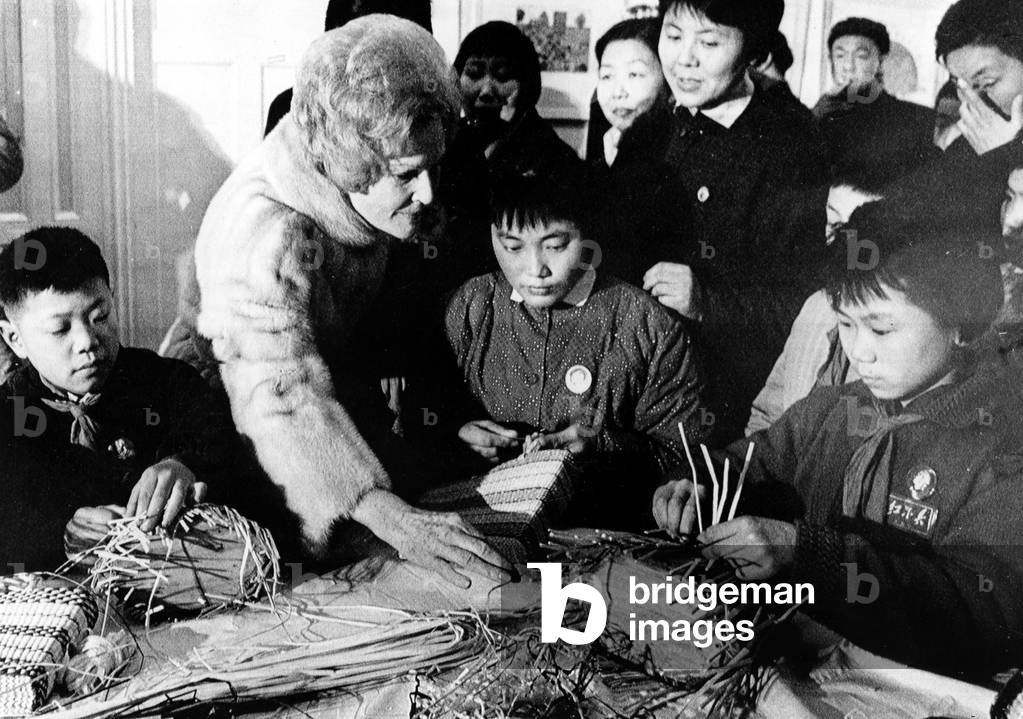 First Lady PAT NIXON with children learning basket weaving at the Shanghai Municipal Children's Palace, February 27, 1972