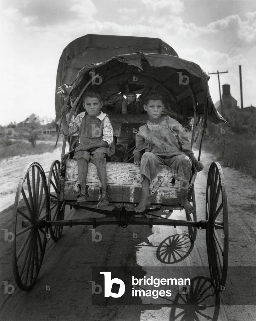 Children of migrant cotton pickers in a covered wagon, Texas, 1931 tphoto)