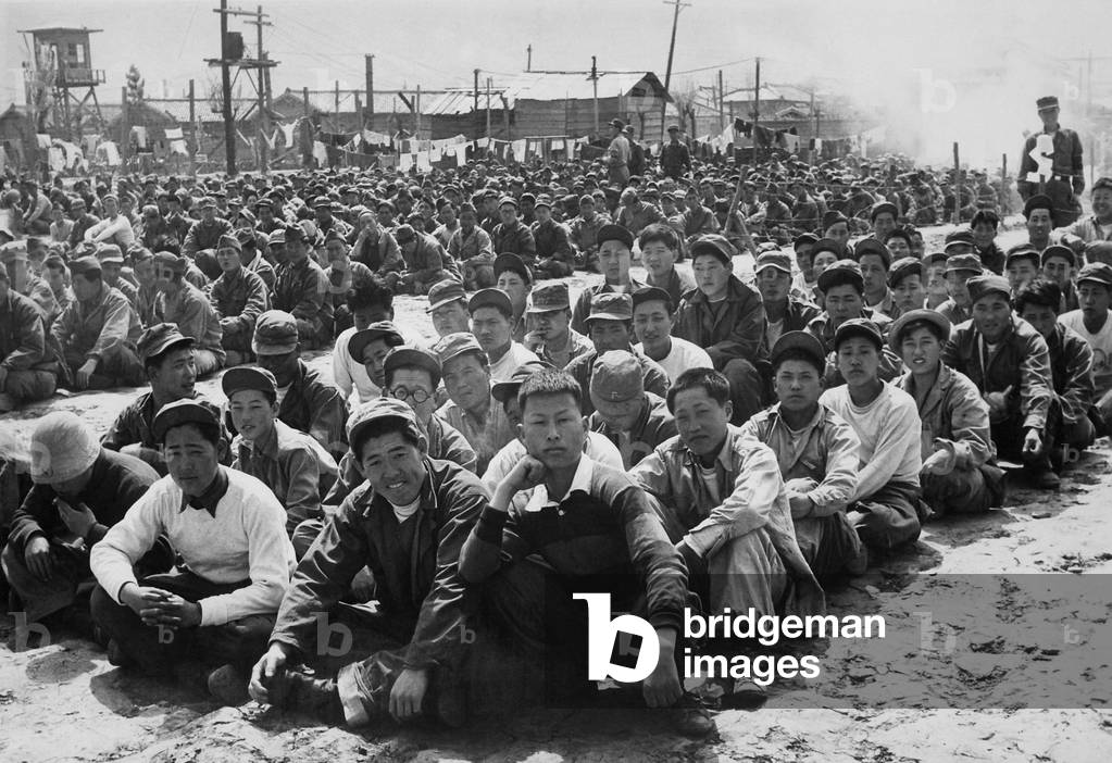 North Korean and Chinese Communist prisoners assembled in a UN POW camp at Pusan, Korea. April 1951. Korean War, 1950-53