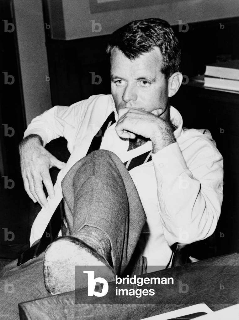 Attorney General Robert F. Kennedy, seated at desk, in 1961