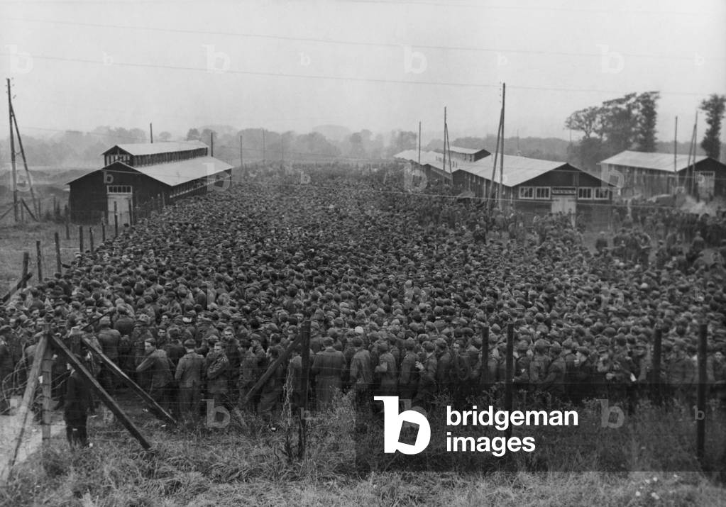 10,000 German prisoners of war line up for lunch at an enclosure in France. The POWs were captured in the 1944 Allied drive through France, during World War 2