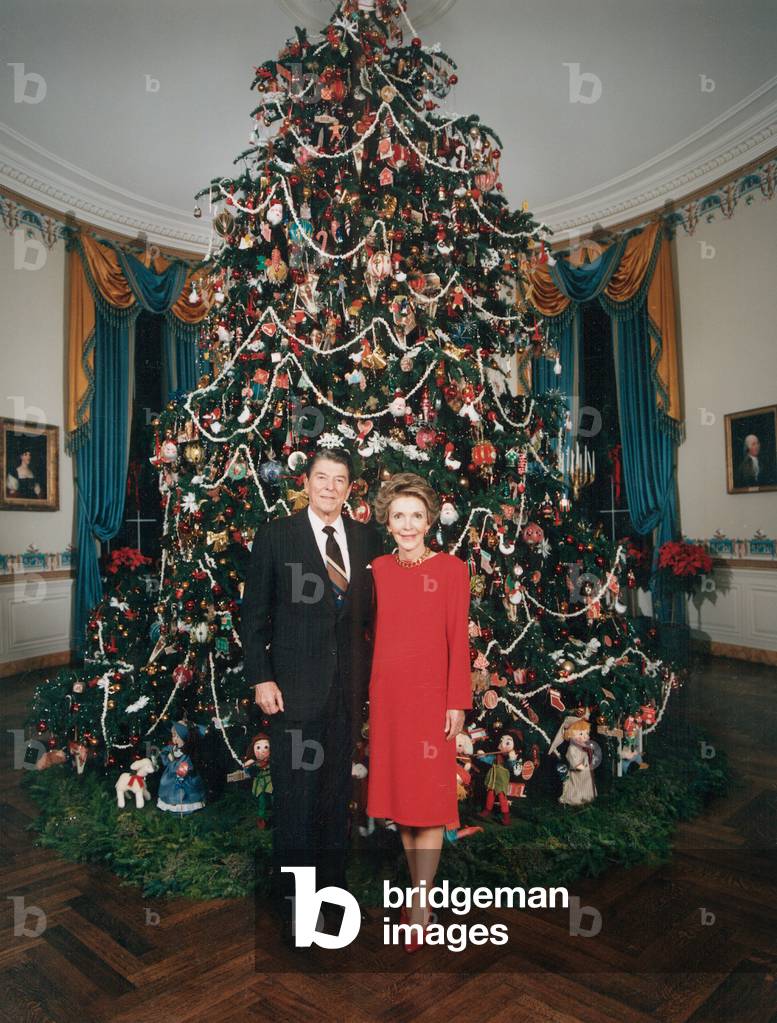 President Ronald Reagan, First Lady Nancy Reagan in front of the White House Christmas tree, 1980s