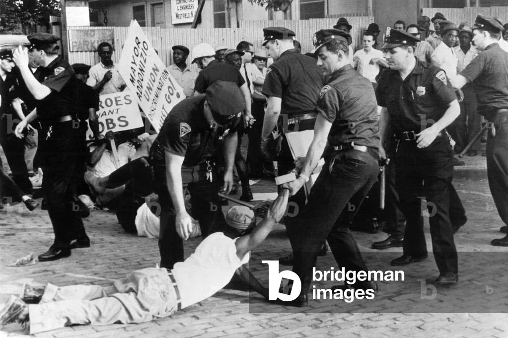 Police attempt to break up demonstration against racial discrimination in jobs at construction site of new Barrington High School, 7/3/63, Newark, NJ.