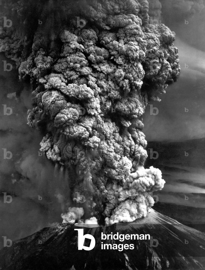 Mount St. Helens in eruption showing the upper third of the mountain. May 18 1980