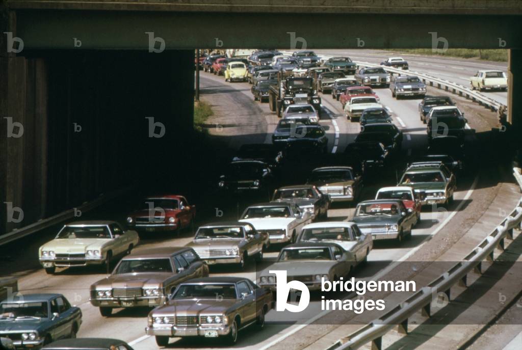Heavy rush hour traffic as commuters drive to their suburban homes from their workplaces in Cleveland. c. 1973-75