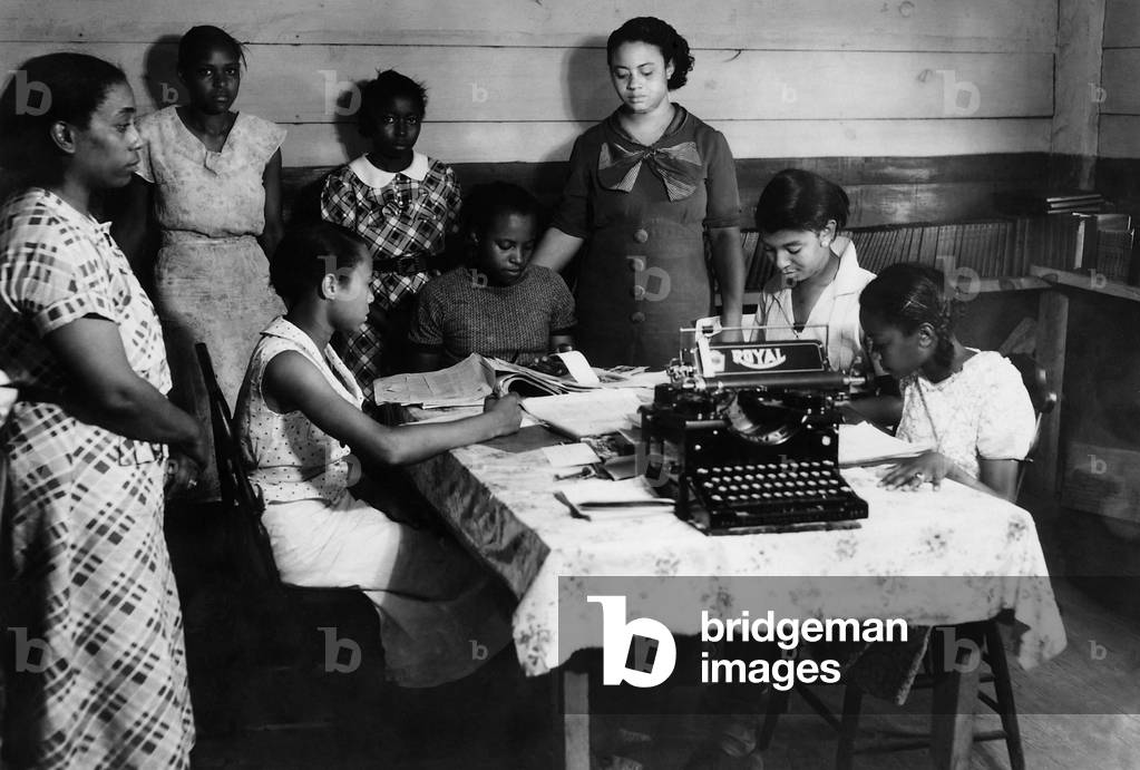 African American students at work in a library, Tupelo, MI., c. 1938. They are in a National Youth Administration program at the Lee County Training School. Most New Deal WPA programs were racially segregated