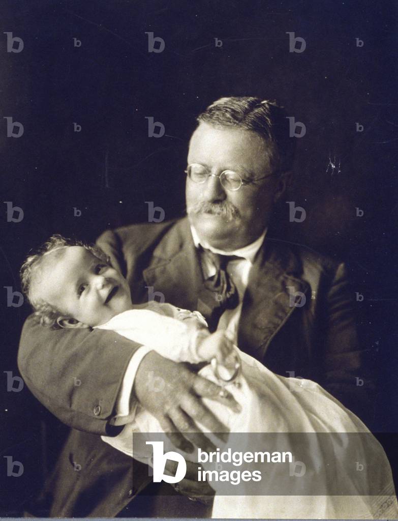 Theodore Roosevelt smiling as he holds his grandchild, Kermit Roosevelt, Jr. 1916 photo. The baby grew up to be director of the CIA's Near East and Africa division, and directed the 1953 coup that brought Reza Shah Pahlavi to power