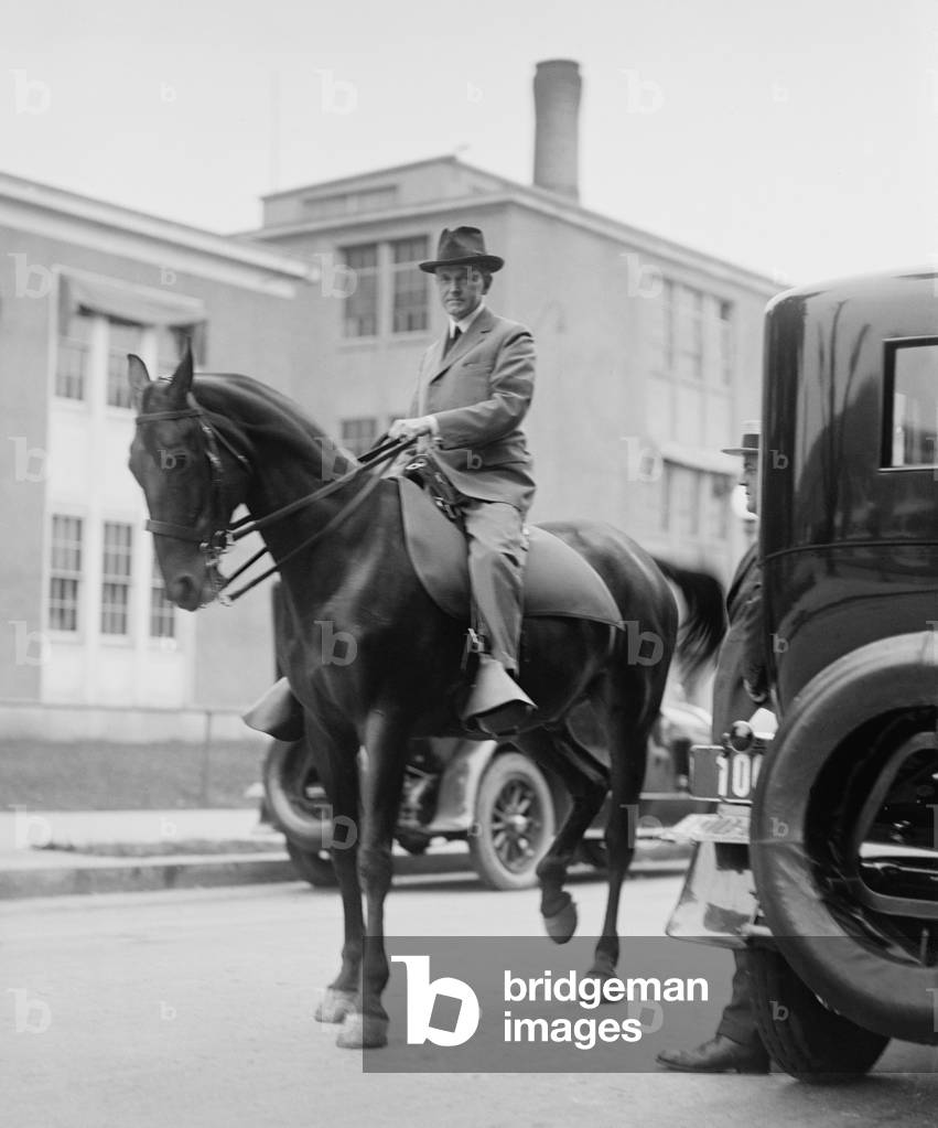 President Calvin Coolidge on horseback in Washington, D.C. street on Aug. 18, 1923