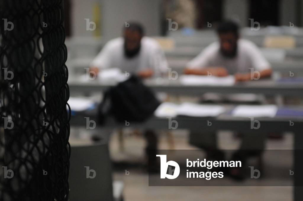 Detainees attend a class at Camp Delta military prison on Guantanamo Bay Naval Station. Courses are offered on life skills languages and art classes. Mar. 29 2010., Photo by:Everett Collection