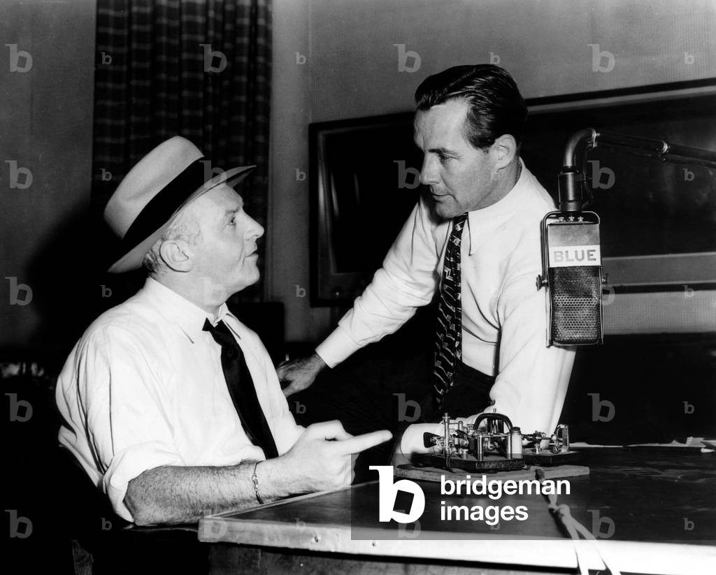 American radio commentators Walter Winchell (left), and Jimmy Fidler (right), just before going on the air for NBC's BLUE network, Hollywood, California, 1944.
