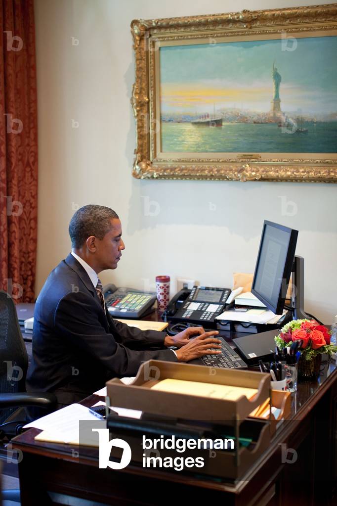 President Barack Obama does last-minute edit of a speech at the desk of Personal Secretary Katie Johnson in the Outer Oval Office Oct. 8 2010.,