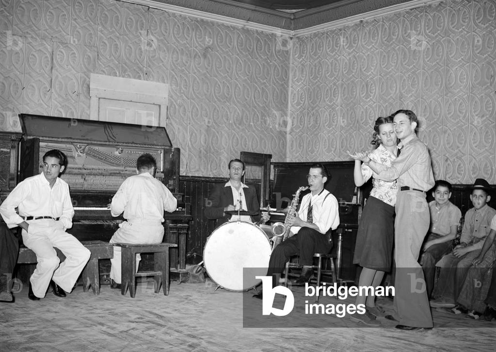 Folk Music. Orchestra and dancers at payday dance. Mogollon, New Mexico. Lee Russell, photographer, 1940