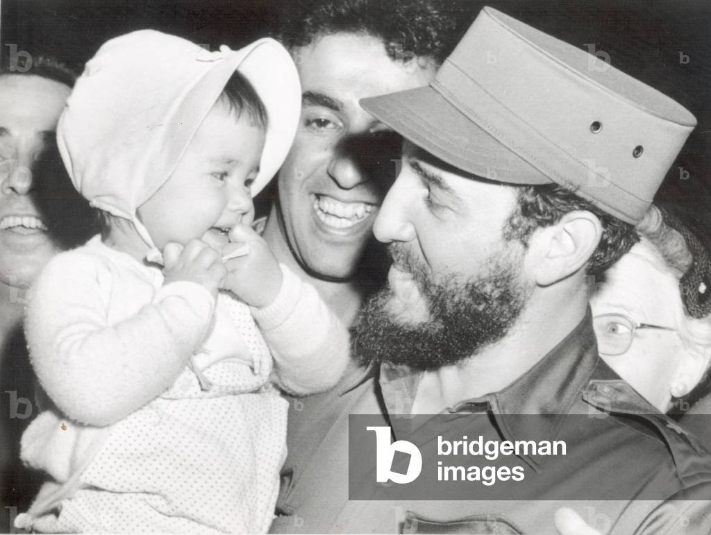 Fidel Castro smiling at 16-month-old Sherry Robin Hayes, of Washington D.C, c. 1959 (photo)