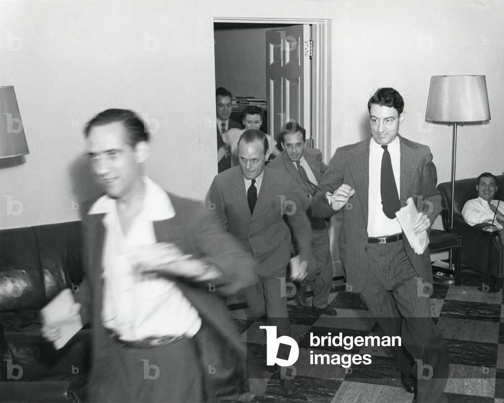 Reporters running through the White House after the announcement of Japan's surrender, ending WW2. August 14, 1945. - (BSLOC_2014_15_21): Reporters running through the White House after the announcement of Japan's surrender, ending WW2. August 14, 1945. - (BSLOC_2014_15_21)