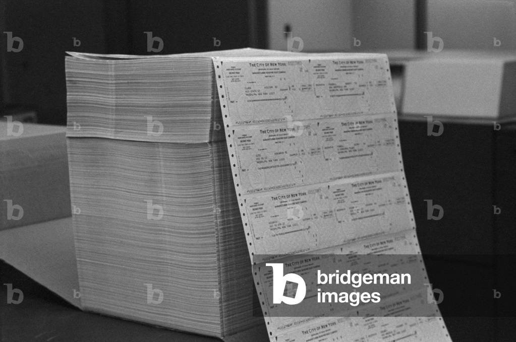 Large stack of computer generated welfare checks at a New York City welfare office. May 24 1976