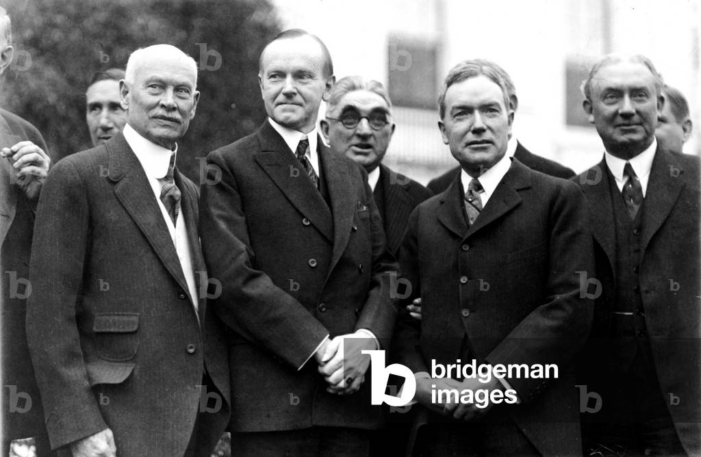 President Calvin Coolidge (1872-33) with Judge Elbert Henry Gary (1846-1927) and John D. Rockefeller, Jr. (1874-1960) and others
