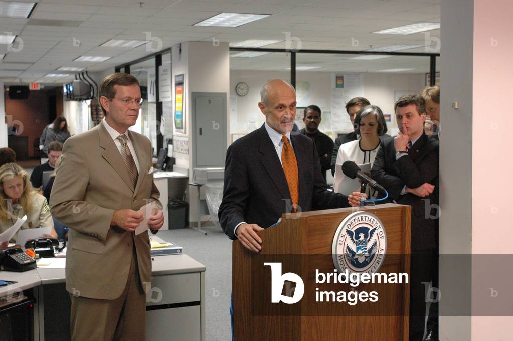 Michael Chertoff Secretary of Homeland Security updates the media on the FEMA response to Hurricane Katrina. Secretary of Health and Human Services Mike Leavitt left looks on