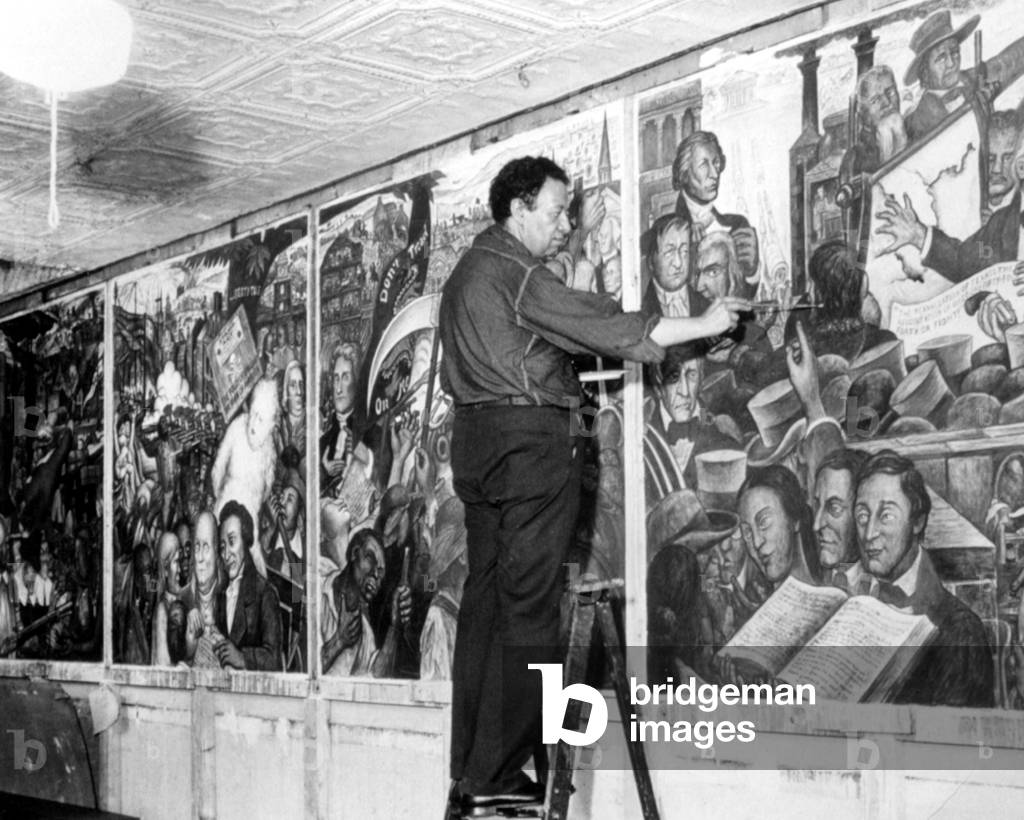 DIEGO RIVERA working on his fresco, 1939 (photo)