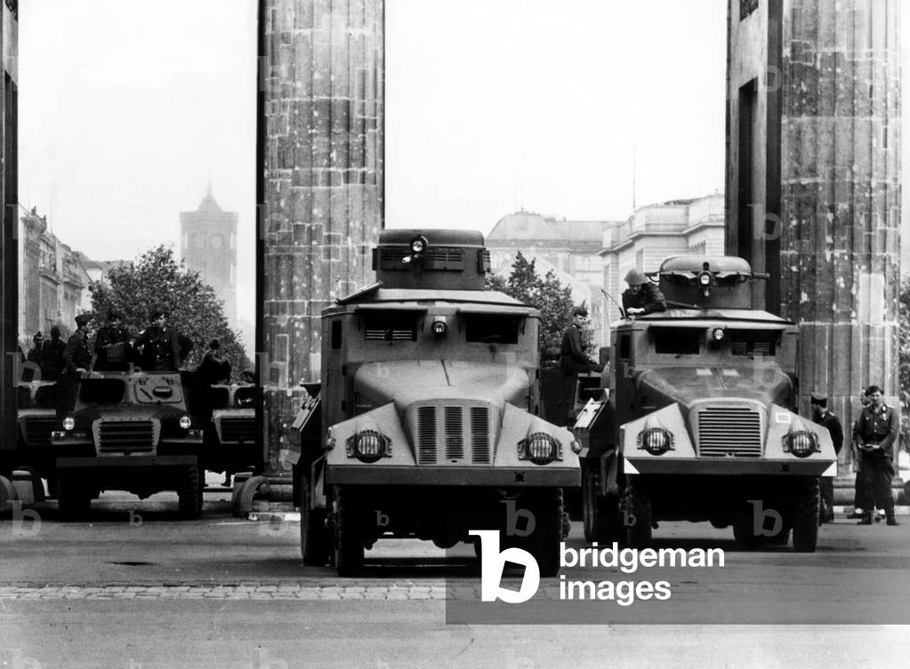 Members of the 'People's Army' barricade the Brandenburg Gate with water-throwers, Berlin, Germany. 1961