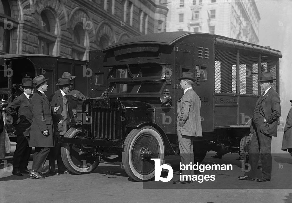 Postmaster General Will Hayes, inspecting the new armored trucks to protect the mails from robbers. Earlier in 1921, the U.S. marines were assigned to protect the mails, December 12, 1921