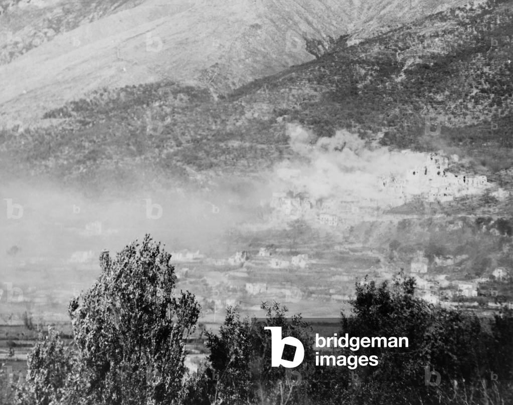 Thick clouds of smoke rising over the town of San Pietro on the German Reinhard Line. After intensive fighting from Dec. 8-17, the town fell to US Army. World War 2