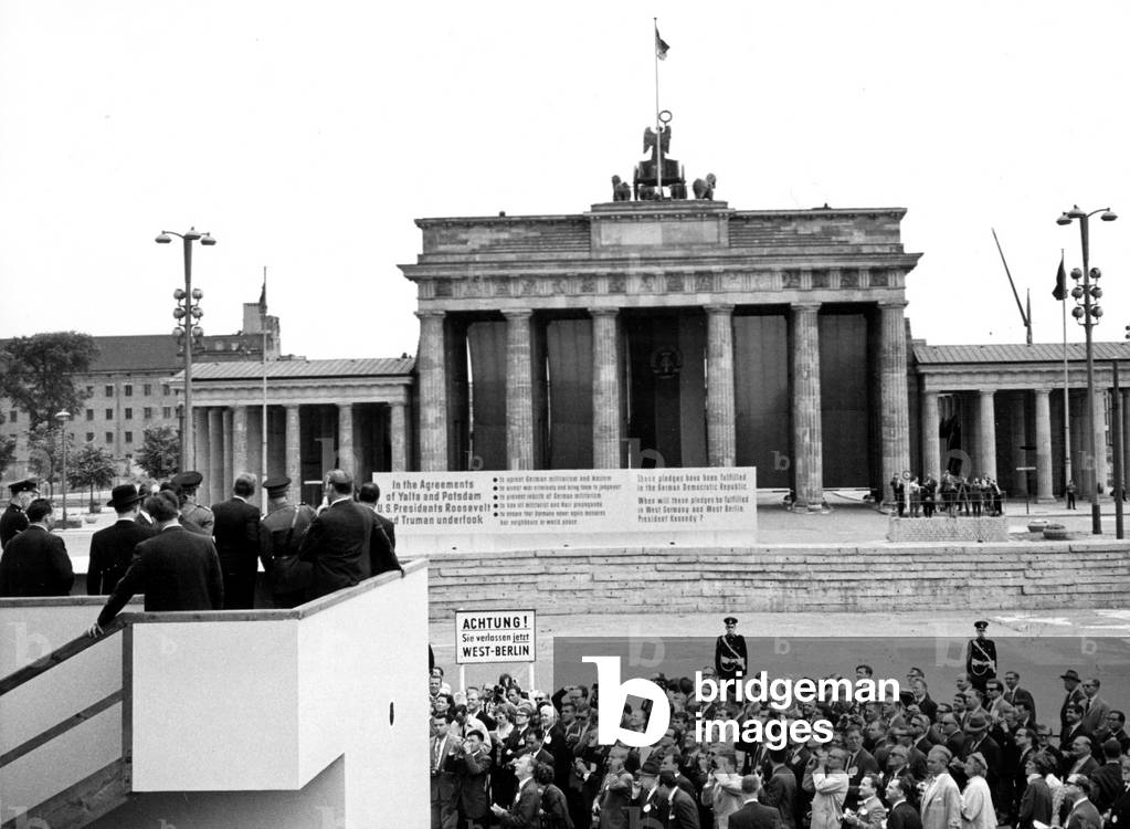 JOHN F. KENNEDY-Viewing the Berlin Wall from a platform at the Brandenburg Gate, Berlin. 6/27/63