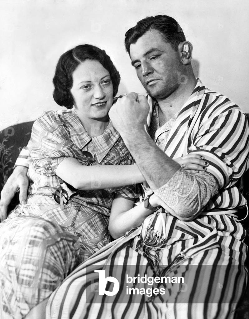James Braddock shows off to wife May the left that confounded Max Baer and won him the Championship. Mayflower Hotel, NY, NY, June 15, 1935