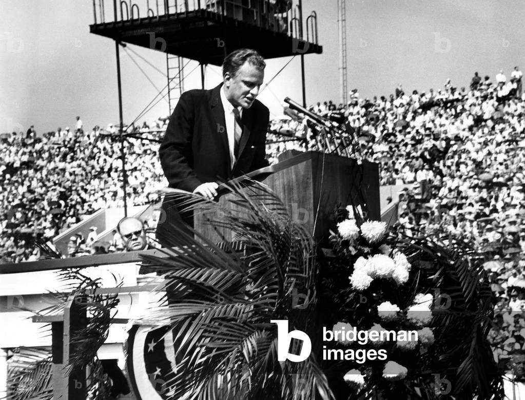 Evangelist, Billy Graham preaching to a crowd at the Chicago Crusade Revival.June 17, 1962. Chicago, Illinois.