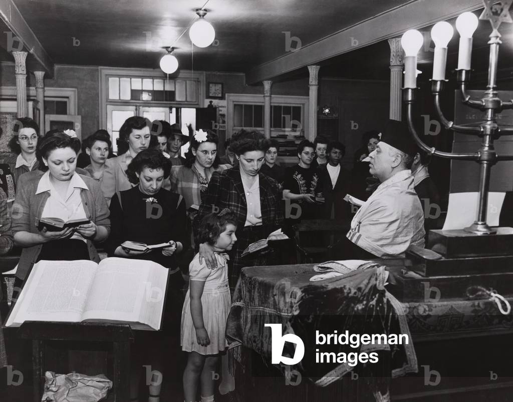 Wives and families of Jewish American GIs attend services in a New York City synagogue on West Twenty-third Street, on D-Day, June 6, 1944