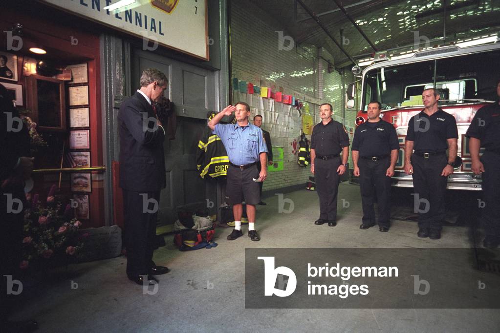 President George W. Bush visits with firefighters at Engine Co. 55 in New York City. Located in Little Italy, the company lost 8 men in the 9-11 Terrorist attacks. Oct. 3, 2001