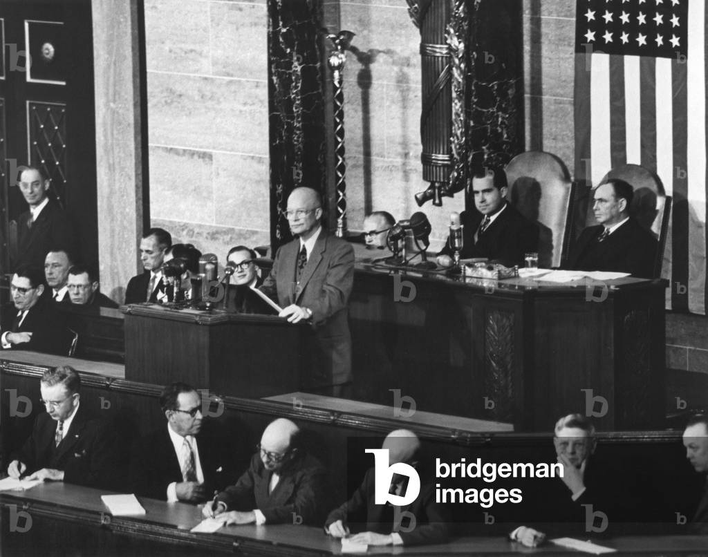 President Dwight Eisenhower delivering his 1954 State of the Union address to Congress. Jan. 7, 1954. VP Nixon and Speaker of the House Joseph Martin, sit behind the President.