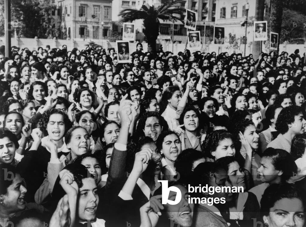 Cairo suffragettes, some carry placards with photographs of Gamal Abdel Nasser. Jan. 22, 1956. The 1956 Egyptian Constitution explicitly stated the equality of opportunity between men and women