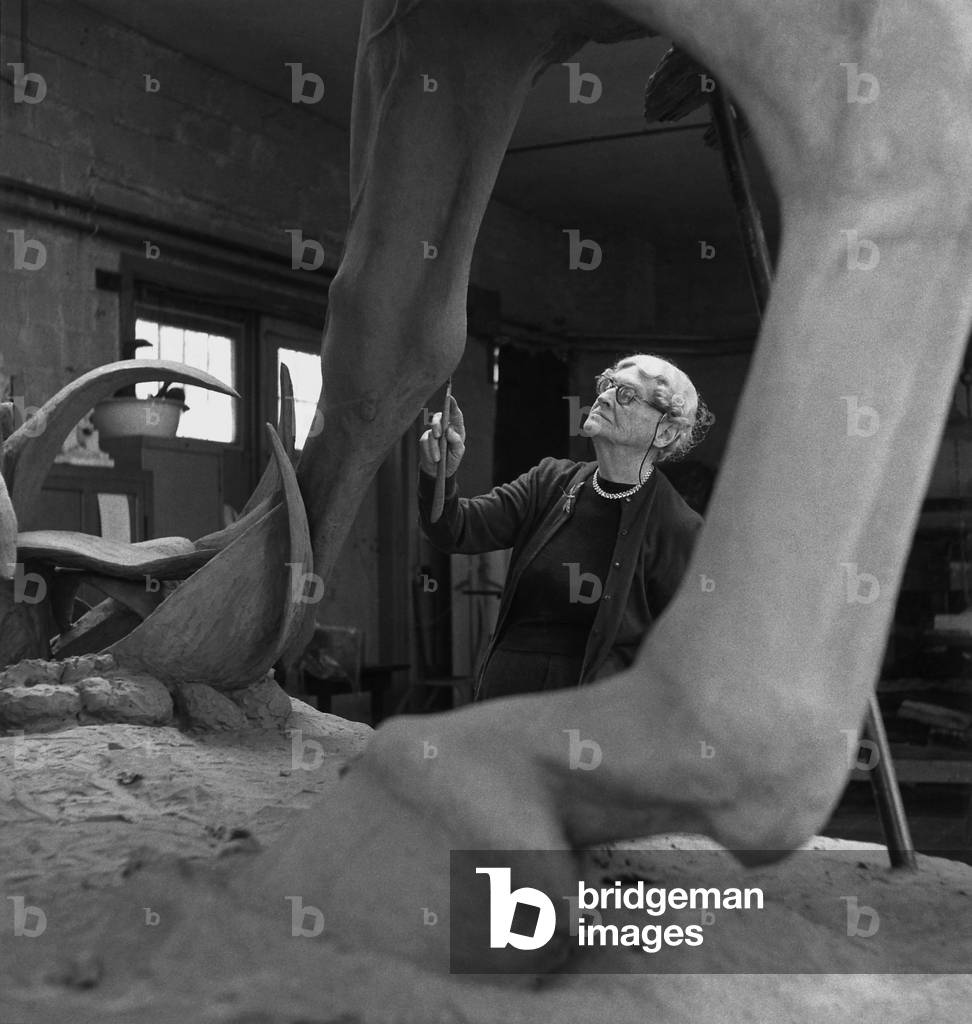 Anna Hyatt Huntington (1876-1973), working on an equestrian statue of Cuban independence leader, Jose Marti. The monumental sculpture is in Central Park, NYC. 1950s.