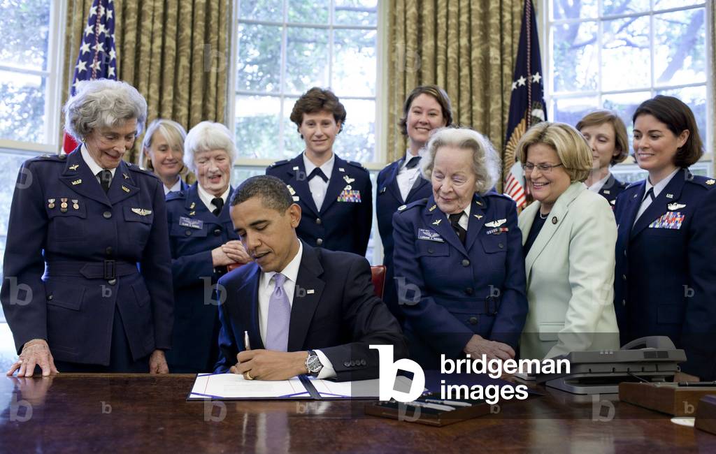 President Obama signs a bill to award a Congressional Gold Medal to the World War II era Women Air force Service Pilots WASP . Over 1000 women flew non-combat mission freeing male pilots for combat. Flanking the President are veterans Bernice Falk Haydu (BSWH_2011_8_310)