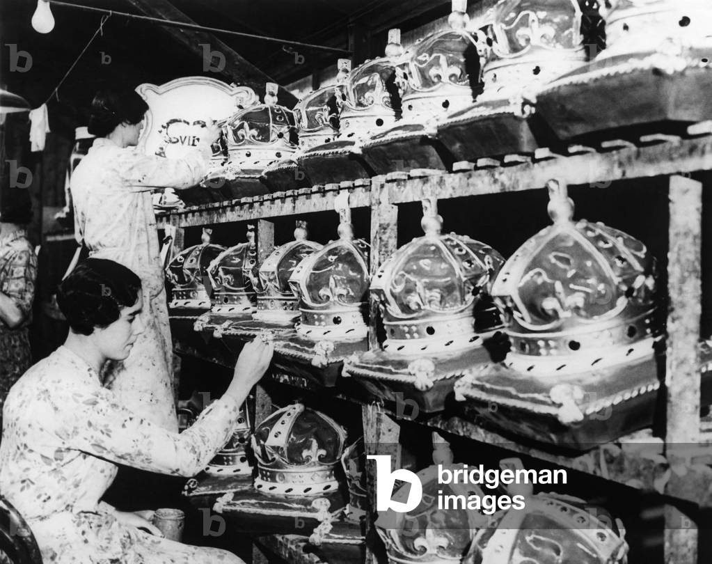 Girls in a factory, as they complete papier-mache crowns for the coronation, England, December 14, 1936