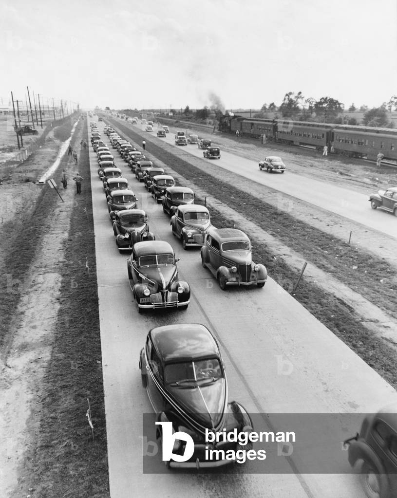 U.S. Highway 62 was expanded into a four lane highway in the 1940s. Post World War II highway construction committed the nation to motor vehicle transport, suppressing development of more fuel efficient railways. c. 1944