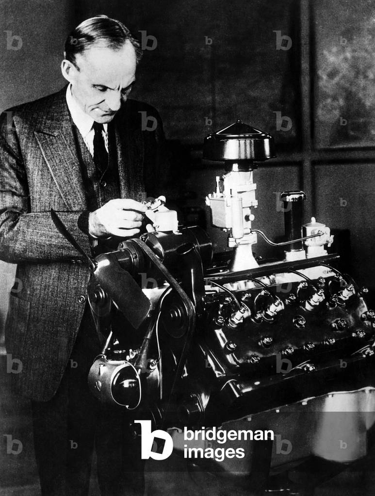 Henry Ford inspecting his new 'V-8' motor. c. 1932