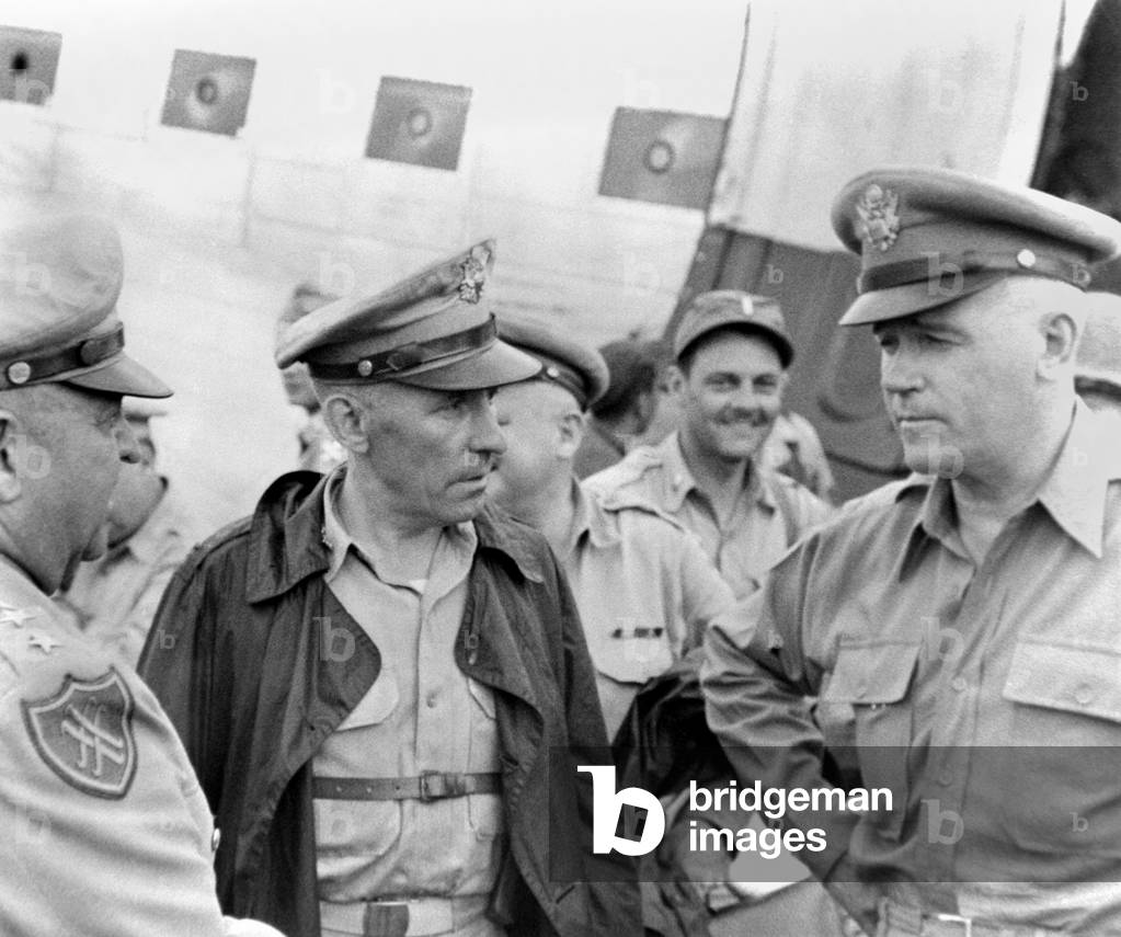 General Lawton Collins (right), U.S. Chief of Staff, arriving in South Korea. At left are General Walton Walker and Brig. Gen. John Church. July 1950. Korean War, 1950-53