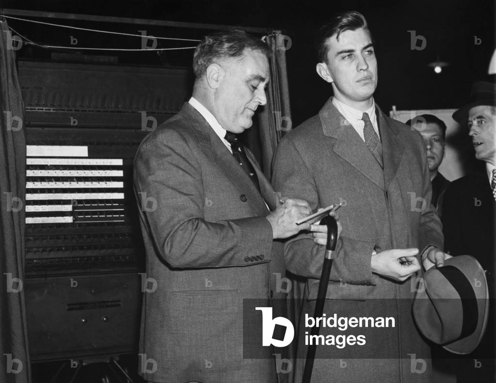 FDR Presidency. US President Franklin Delano Roosevelt and Franklin Roosevelt, Jr., voting at the polls, Hyde Park, New York, November 6, 1936