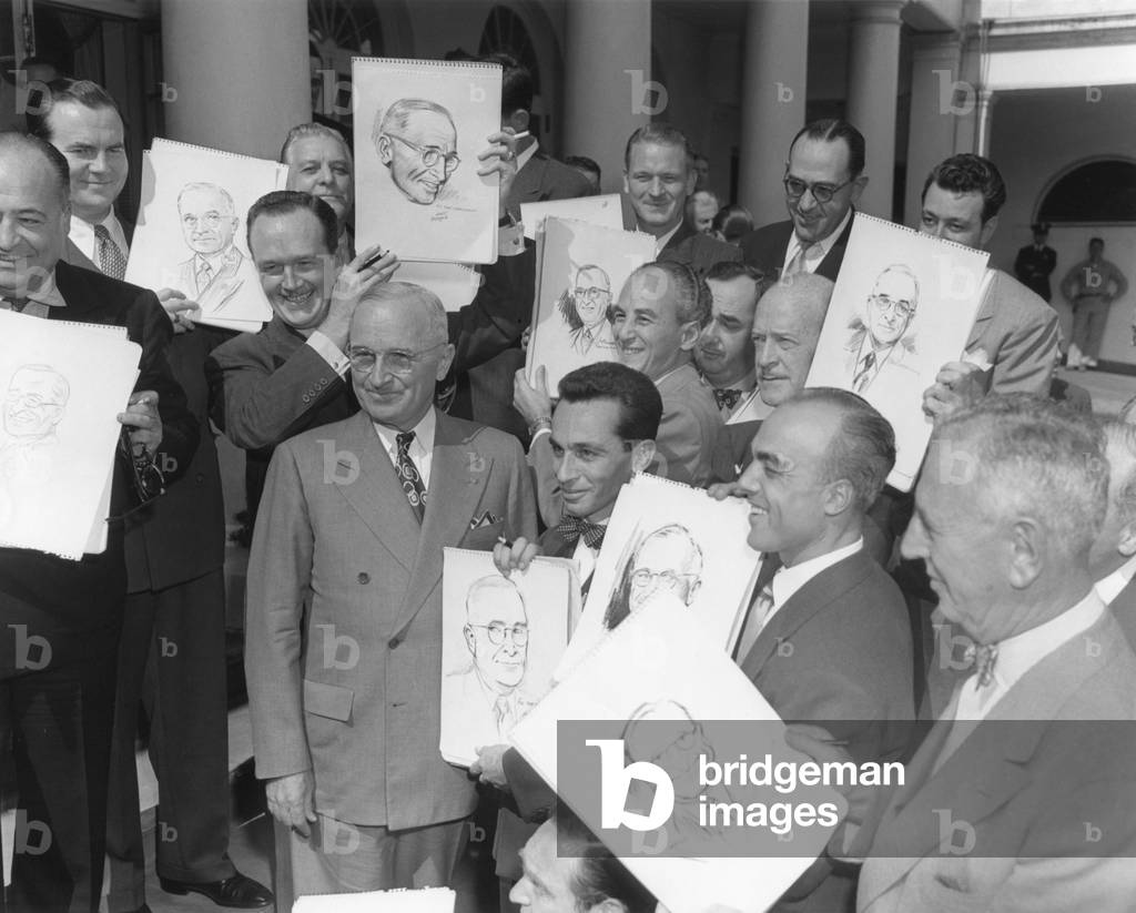 President Harry Truman posing at the White House with visiting cartoonists. Oct. 3, 1949