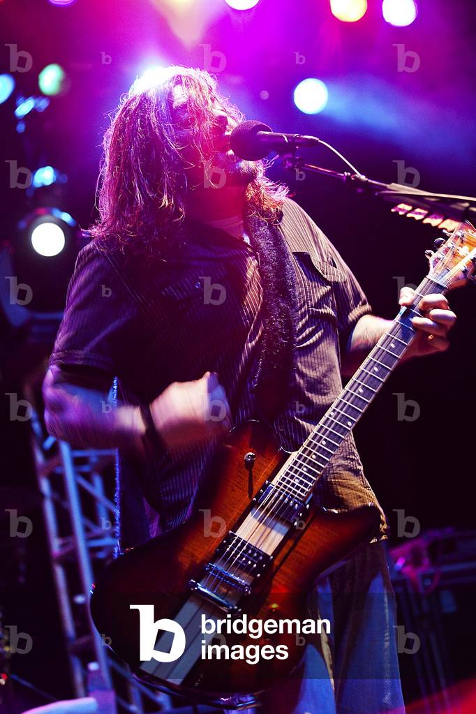 Shaun Morgan Welgemoed of the rock group Seether plays for Marines Sailors and their families during a concert on Marine Corps Base Hawaii. Dec. 17 2010