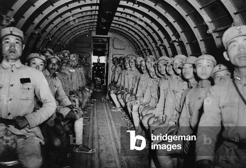 Chinese soldiers enroute to India in a U.S. DC-3 transport airplane. c. 1943. World War 2