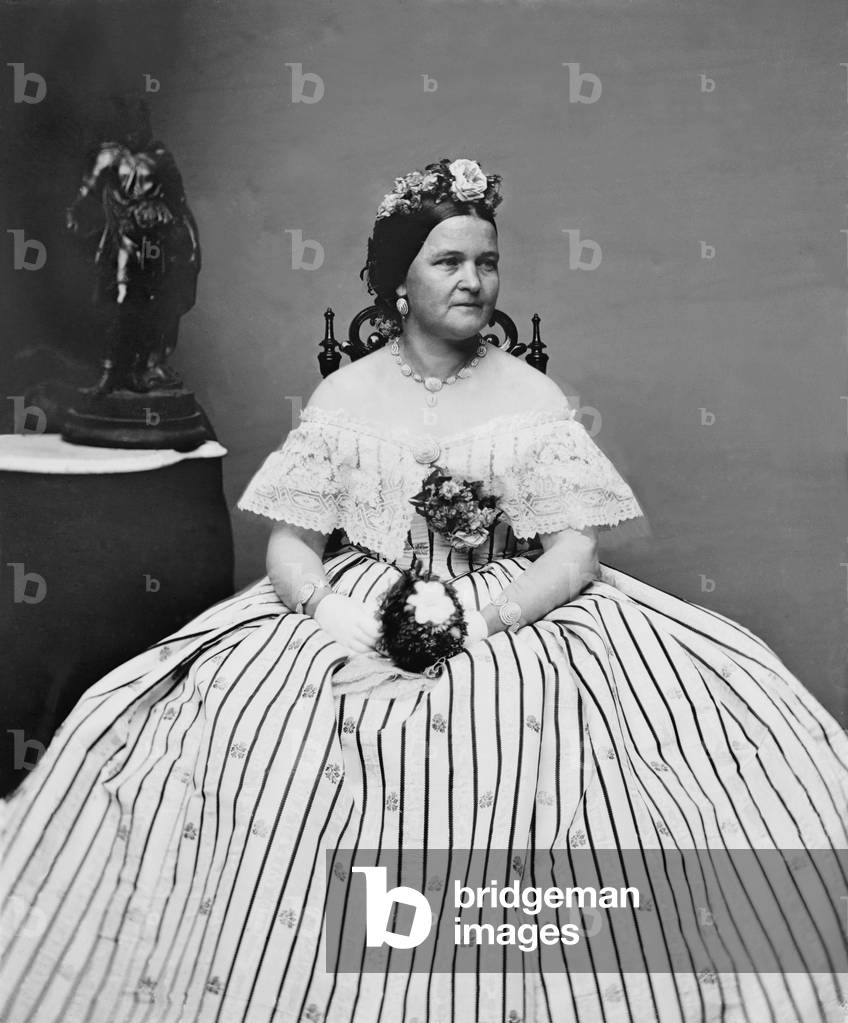 Mary Todd Lincoln (1818-1882), wife of Abraham Lincoln, in a ball gown and flowers in her hair. She was both admired and criticized for her stylish extravigence