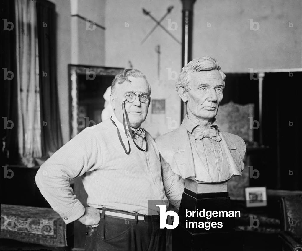 W. Clark Noble (1858-1938) poses next to his bust of Abraham Lincoln, 1924