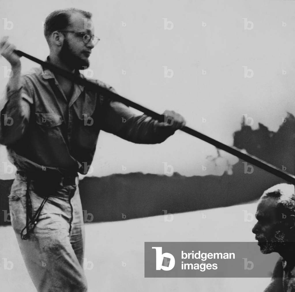 Michael Rockefeller, in a canoe with a native during his anthropological exploration in Dutch New Guinea. On Nov. 17, 1961 he swam for help after his dugout canoe was swamped 3 miles from shore and was never seen again.